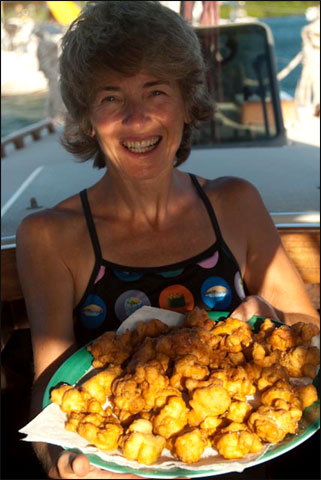Ann Vanderhoof with the fritters she made from lambi (conch)