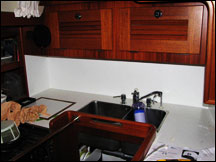 White Formica installation in Mahina Tiare galley